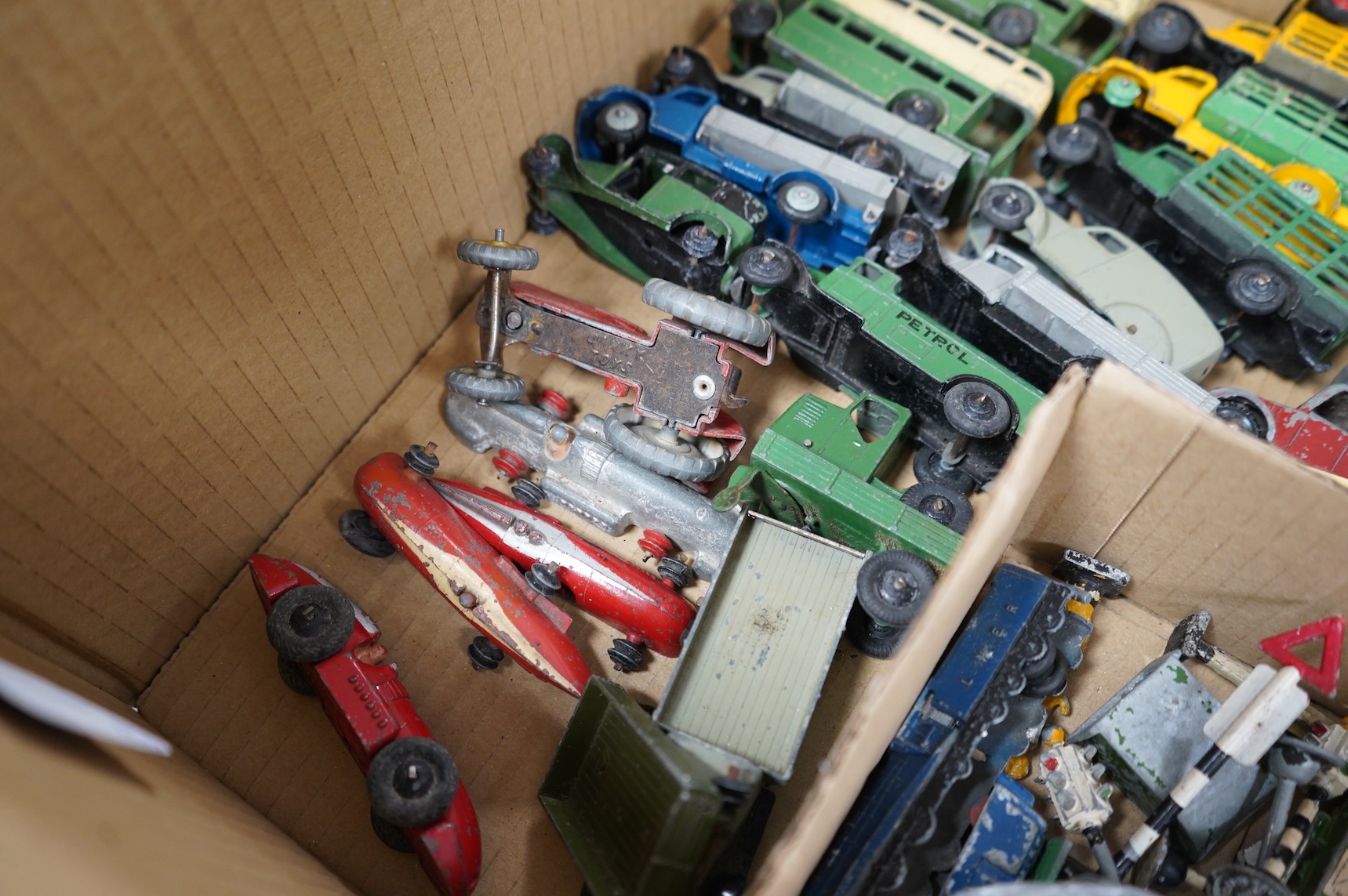 Forty-four 1950s/60s Dinky Toys, etc. including thirty-two commercial vehicles, public transport vehicles, etc. including; market gardener’s wagons, petrol wagons, double deck buses, a Bedford tipper, racing cars, a mech